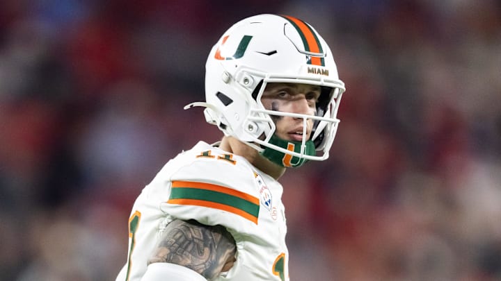 Jan 8, 2026; Glendale, AZ, USA; Miami Hurricanes quarterback Carson Beck (11) against the Mississippi Rebels during the 2026 Fiesta Bowl and semifinal game of the College Football Playoff at State Farm Stadium. Mandatory Credit: Mark J. Rebilas-Imagn Images