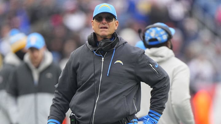 Dec 28, 2024; Foxborough, Massachusetts, USA; Los Angeles Chargers head coach Jim Harbaugh looks up at the scoreboard from the sidelines during the first half against the New England Patriots at Gillette Stadium. Mandatory Credit: Gregory Fisher-Imagn Images