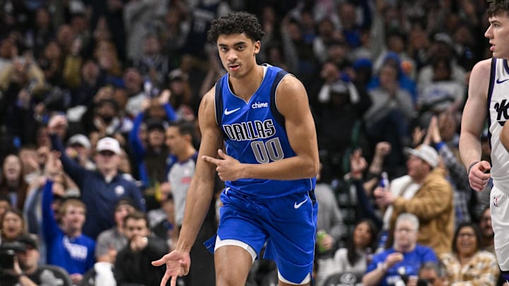 Feb 10, 2025; Dallas, Texas, USA; Dallas Mavericks guard Max Christie (00) celebrates after he makes a three point basket against the Sacramento Kings during the second half at the American Airlines Center. Mandatory Credit: Jerome Miron-Imagn Images