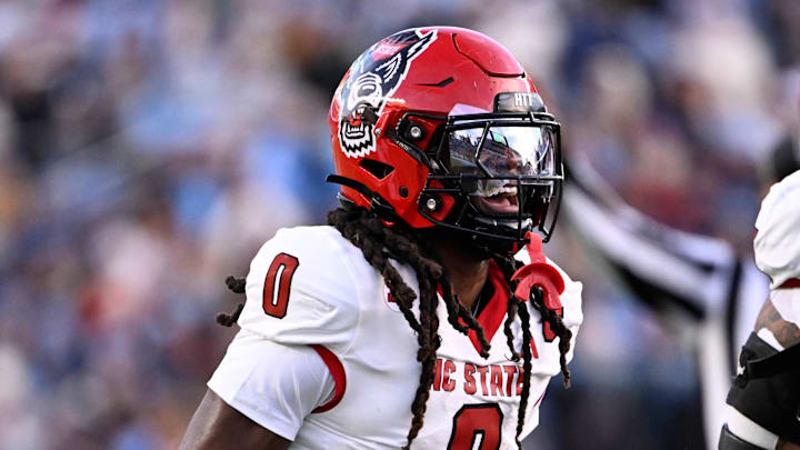 Nov 30, 2024; Chapel Hill, North Carolina, USA; North Carolina State Wolfpack linebacker Sean Brown (0) reacts after recovering a fumble in the first quarter at Kenan Memorial Stadium. Mandatory Credit: Bob Donnan-Imagn Images Nov 30, 2024; Chapel Hill, North Carolina, USA; North Carolina State Wolfpack linebacker Sean Brown (0) reacts after recovering a fumble in the first quarter at Kenan Memorial Stadium. Mandatory Credit: Bob Donnan-Imagn Images