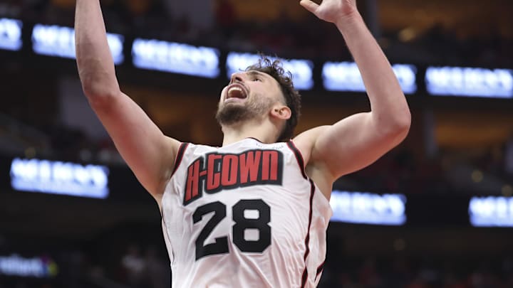 May 4, 2025; Houston, Texas, USA; Houston Rockets center Alperen Sengun (28) shoots the ball as Golden State Warriors forward Draymond Green (23) defends during game seven of the first round for the 2025 NBA Playoffs at Toyota Center. Mandatory Credit: Troy Taormina-Imagn Images