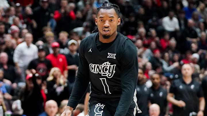 Cincinnati Bearcats guard Day Day Thomas (1) dribbles down the court with the ball in the first half of a NCAA men’s basketball game between the Cincinnati Bearcats and Dayton Flyers, Friday, Dec. 20, 2024, at Heritage Bank Center in downtown Cincinnati.