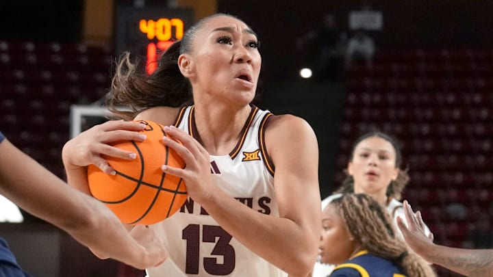 ASU Sun Devils guard Last-Tear Poa (13) drives into the lane as Coppin State Bald Eagles guard Skylar Barnes (5) defends at Desert Financial Arena on Nov. 3, 2025. ASU Sun Devils guard Last-Tear Poa (13) drives into the lane as Coppin State Bald Eagles guard Skylar Barnes (5) defends at Desert Financial Arena on Nov. 3, 2025.