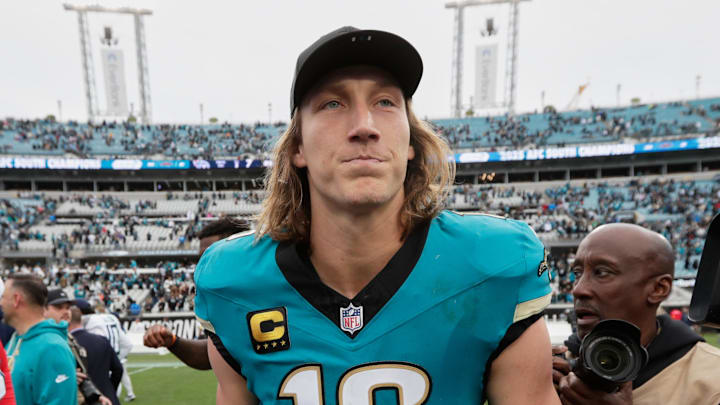 Jan 4, 2026; Jacksonville, Florida, USA; Jacksonville Jaguars quarterback Trevor Lawrence (16) and Tennessee Titans defensive tackle Jeffery Simmons (98) shake hands after the game at EverBank Stadium. Mandatory Credit: Travis Register-Imagn Images