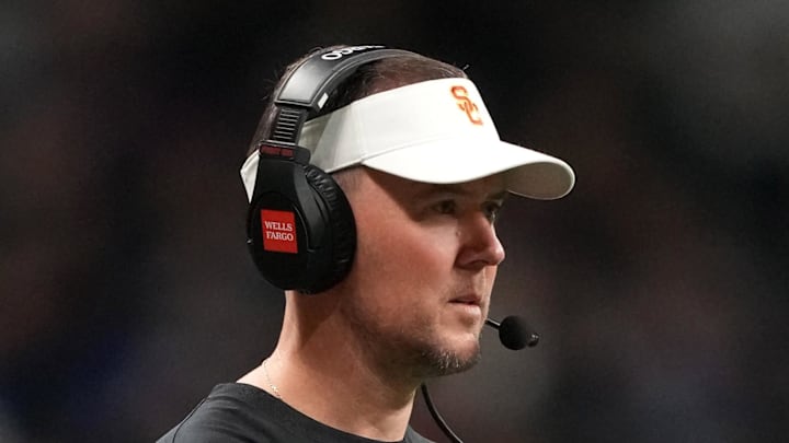 Dec 30, 2025; San Antonio, TX, USA; Southern California Trojans head coach Lincoln Riley watches from the sidelines against the TCU Horned Frogs in the first half during the Alamo Bowl at Alamodome. Mandatory Credit: Kirby Lee-Imagn Images