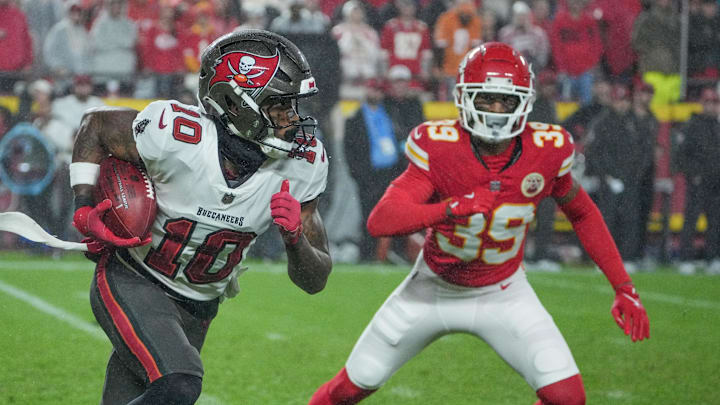 Nov 4, 2024; Kansas City, Missouri, USA; Tampa Bay Buccaneers wide receiver Trey Palmer (10) runs the ball as Kansas City Chiefs cornerback Keith Taylor Jr. (39) defends during the game at GEHA Field at Arrowhead Stadium. Mandatory Credit: Denny Medley-Imagn Images