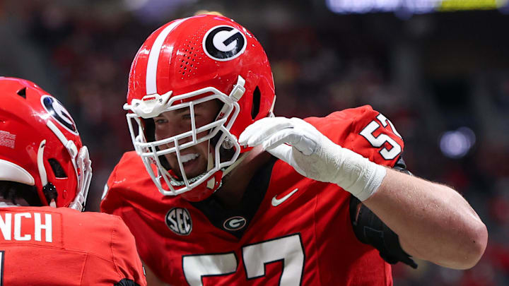 Nov 28, 2025; Atlanta, Georgia, USA; Georgia Bulldogs wide receiver Zachariah Branch (1) celebrates with offensive lineman Monroe Freeling (57) after a touchdown catch against the Georgia Tech Yellow Jackets in the second quarter at Mercedes-Benz Stadium. Mandatory Credit: Brett Davis-Imagn Images Nov 28, 2025; Atlanta, Georgia, USA; Georgia Bulldogs wide receiver Zachariah Branch (1) celebrates with offensive lineman Monroe Freeling (57) after a touchdown catch against the Georgia Tech Yellow Jackets in the second quarter at Mercedes-Benz Stadium. Mandatory Credit: Brett Davis-Imagn Images