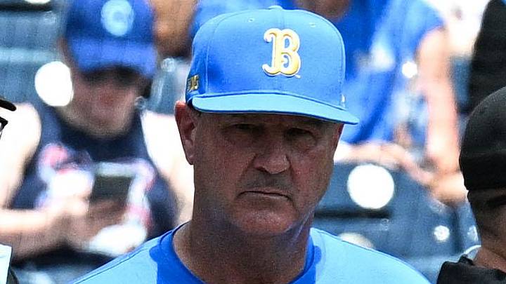Jun 14, 2025; Omaha, Neb, USA;  Murray State Racers head coach Dan Skirka and UCLA Bruins head coach John Savage meet with umpires before the game at Charles Schwab Field. Mandatory Credit: Steven Branscombe-Imagn Images