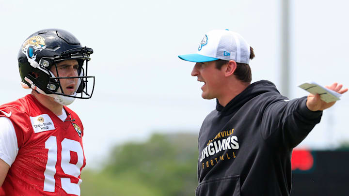 Jacksonville Jaguars quarterback Seth Henigan (19) listens to offensive coordinator Grant Udinski during a rookie minicamp at Miller Electric Center Saturday, May 10, 2025 in Jacksonville, Fla. [Corey Perrine/Florida Times-Union]