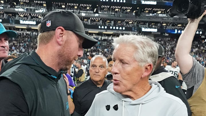 Nov 2, 2025; Paradise, Nevada, USA; The Jacksonville Jaguars head coach Liam Coen and the Las Vegas Raiders head coach Pete Carroll meet after the win against the Las Vegas Raiders at Allegiant Stadium. Mandatory Credit: Kirby Lee-Imagn Images