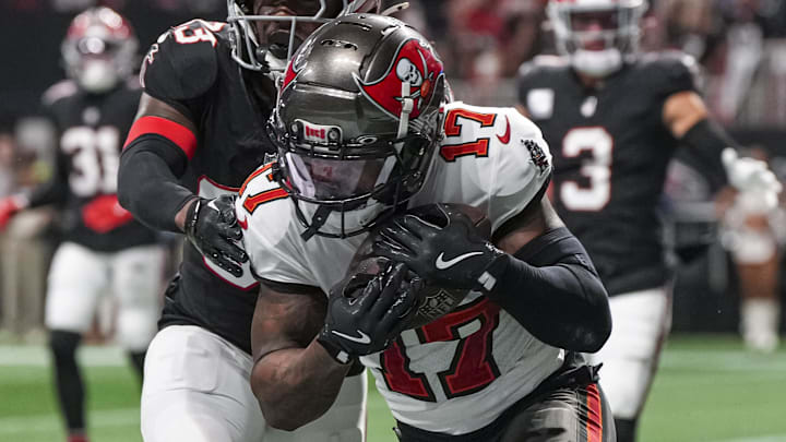 Oct 3, 2024; Atlanta, Georgia, USA; Tampa Bay Buccaneers wide receiver Sterling Shepard (17) catches a touchdown pass behind Atlanta Falcons cornerback Antonio Hamilton Sr. (33) during the first half at Mercedes-Benz Stadium. Mandatory Credit: Dale Zanine-Imagn Images