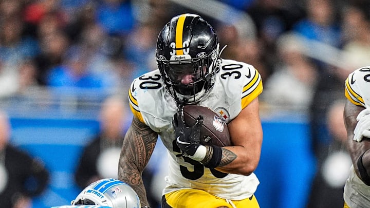 Pittsburgh Steelers running back Jaylen Warren (30) runs against Detroit Lions cornerback D.J. Reed (4) during the second half at Ford Field in Detroit on Sunday, Dec. 21, 2025. Pittsburgh Steelers running back Jaylen Warren (30) runs against Detroit Lions cornerback D.J. Reed (4) during the second half at Ford Field in Detroit on Sunday, Dec. 21, 2025.