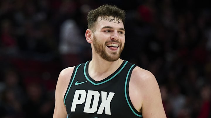 Jan 5, 2026; Portland, Oregon, USA; Portland Trail Blazers center Donovan Clingan (23) celebrates after scoring a three point basket during the first half against the Utah Jazz at Moda Center. Mandatory Credit: Troy Wayrynen-Imagn Images Jan 5, 2026; Portland, Oregon, USA; Portland Trail Blazers center Donovan Clingan (23) celebrates after scoring a three point basket during the first half against the Utah Jazz at Moda Center. Mandatory Credit: Troy Wayrynen-Imagn Images