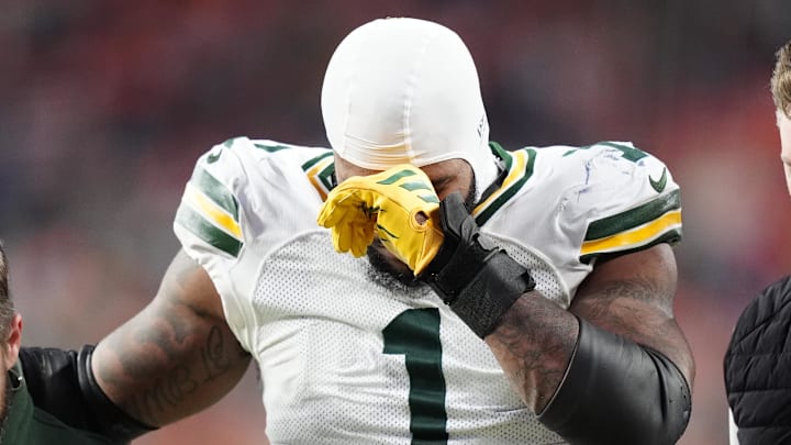 Green Bay Packers defensive end Micah Parsons (1) walks off the field with help from medical personnel at Denver. Green Bay Packers defensive end Micah Parsons (1) walks off the field with help from medical personnel at Denver.