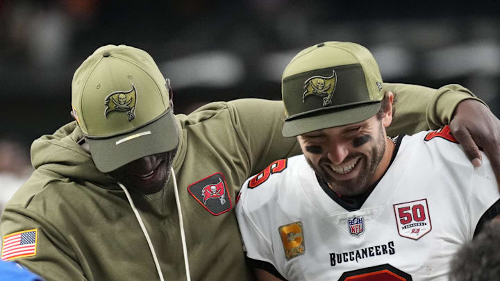 Tampa Bay Buccaneers head coach Todd Bowles and quarterback Baker Mayfield (6) celebrate a win over the New Orleans Saints