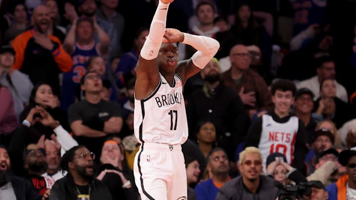 Nov 15, 2024; New York, New York, USA; Brooklyn Nets guard Dennis Schroder (17) reacts after a three point shot against New York Knicks guard Josh Hart (3) during the fourth quarter at Madison Square Garden. Mandatory Credit: Brad Penner-Imagn Images