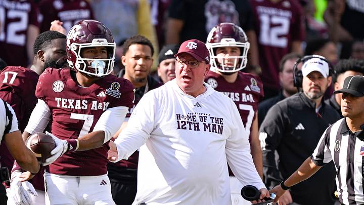 Texas A&M Aggies head coach Mike Elko reacts to a call during the game between the Aggies and the Hurricanes at Kyle Field. Texas A&M Aggies head coach Mike Elko reacts to a call during the game between the Aggies and the Hurricanes at Kyle Field.