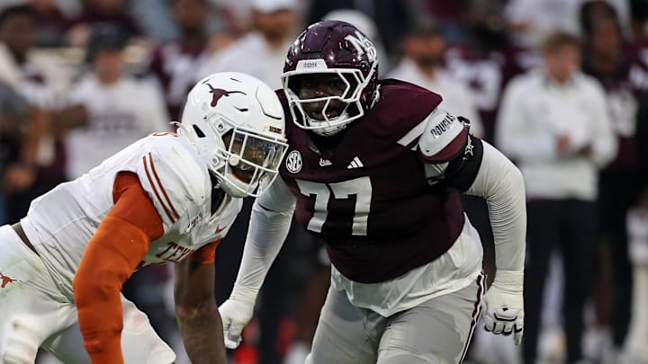 Texas Longhorns defensive linemen Colin Simmons (1) gets past Mississippi State Bulldogs offensive linemen Jayvin Q. James (77) during the third quarter at Davis Wade Stadium at Scott Field.
