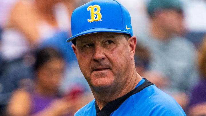 Jun 16, 2025; Omaha, Neb, USA; UCLA Bruins head coach John Savage walks off the field before the game against the LSU Tigers at Charles Schwab Field. Mandatory Credit: Dylan Widger-Imagn Images Jun 16, 2025; Omaha, Neb, USA; UCLA Bruins head coach John Savage walks off the field before the game against the LSU Tigers at Charles Schwab Field. Mandatory Credit: Dylan Widger-Imagn Images