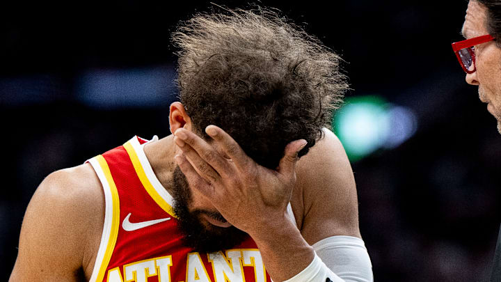 Trae Young wipes the sweat off his brow
