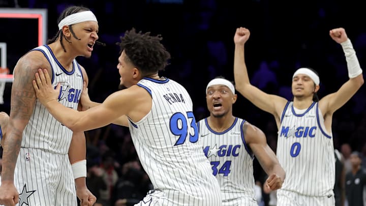 Jan 7, 2026; Brooklyn, New York, USA; Orlando Magic forward Paolo Banchero (5) celebrates his overtime game-winning three point shot against the Brooklyn Nets with guard Desmond Bane (3) and forward Noah Penda (93) and center Wendell Carter Jr. (34) and guard Anthony Black (0) at Barclays Center. Mandatory Credit: Brad Penner-Imagn Images