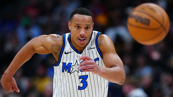 Dec 18, 2025; Denver, Colorado, USA; Orlando Magic guard Desmond Bane (3) chases down a loose ball in the second half against the Denver Nuggets at Ball Arena. Mandatory Credit: Ron Chenoy-Imagn Images