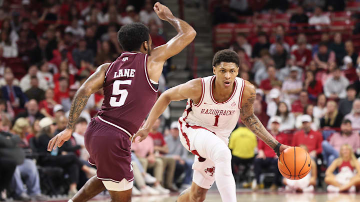 Arkansas guard Meleek Thomas (1) drives against Texas A&M Aggies guard Jacari Lane (5) during the second half at Bud Walton Arena. Arkansas won 99-84. 