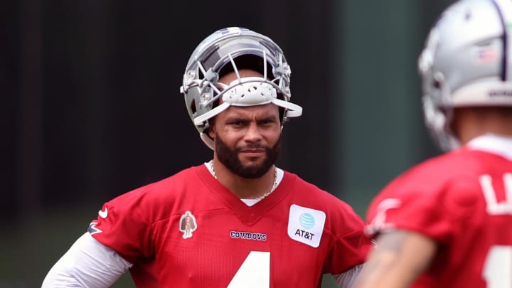 Dallas Cowboys quarterback Dak Prescott (4) and quarterback Trey Lance (19) stand on the field during practice at the Ford Center at the Star Training Facility in Frisco, Texas. Dallas Cowboys quarterback Dak Prescott (4) and quarterback Trey Lance (19) stand on the field during practice at the Ford Center at the Star Training Facility in Frisco, Texas.