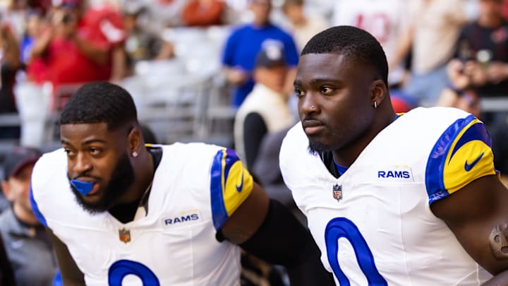 Dec 7, 2025; Glendale, Arizona, USA; Los Angeles Rams linebacker Byron Young (0) and Jared Verse (8) and against the Arizona Cardinals at State Farm Stadium. Mandatory Credit: Mark J. Rebilas-Imagn Images