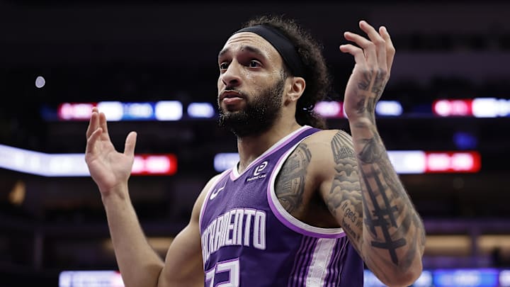 Feb 19, 2026; Sacramento, California, USA; Sacramento Kings guard Devin Carter (22) gestures to the Orlando Magic bench to acknowledge the foul he committed during the third quarter at Golden 1 Center. Mandatory Credit: Kelley L Cox-Imagn Images