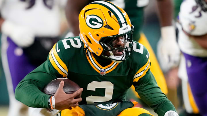 Dec 27, 2025; Green Bay, Wisconsin, USA; Green Bay Packers quarterback Malik Willis (2) runs the ball during the third quarter against the Baltimore Ravens at Lambeau Field.
