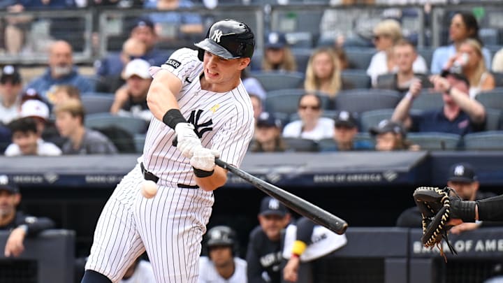 Sep 7, 2025; Bronx, New York, USA; New York Yankees first baseman Ben Rice (22) hits the ball for a homerun during the first inning against the Toronto Blue Jays at Yankee Stadium. Mandatory Credit: Mark Smith-Imagn Images