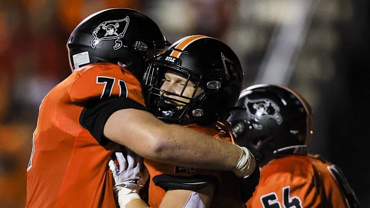 Ryle's Max Neumann (71) celebrates after Jacob Savage (21) scores a touchdown against Campbell County in the first half at Ryle High School Oct. 11, 2024. Ryle's Max Neumann (71) celebrates after Jacob Savage (21) scores a touchdown against Campbell County in the first half at Ryle High School Oct. 11, 2024.
