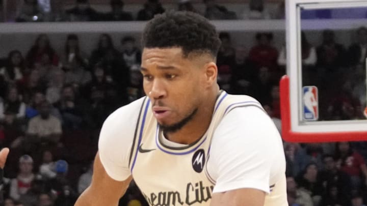 Chicago Bulls guard Ayo Dosunmu defends Milwaukee Bucks forward Giannis Antetokounmpo.