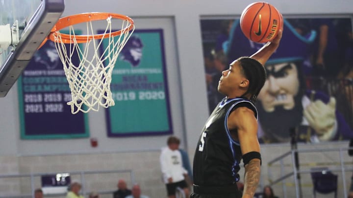 Darius Acuff Jr. from IMG Academy dunks against Oak Ridge at the City of Palms Classic at Suncoast Credit Union Arena in Fort Myers on Monday, Dec. 23, 2024.