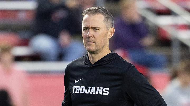 Oct 24, 2026; Madison, Wisconsin, USA;  USC Trojans head coach Lincoln Riley watches his team during warmups before the game against the Wisconsin Badgers at Camp Randall Stadium.  Mandatory Credit: Anthony Wahl-Imagn Images