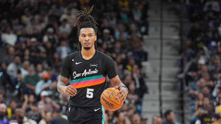 Jan 7, 2026; San Antonio, Texas, USA; San Antonio Spurs guard Stephon Castle (5) dribbles up the court in the first half against the Los Angeles Lakers at Frost Bank Center.