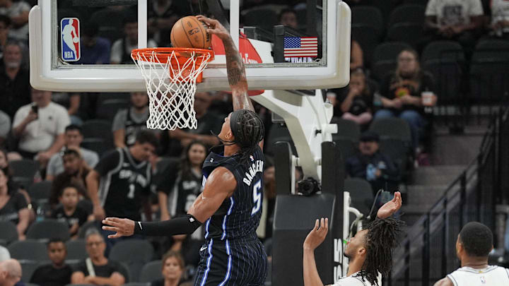 Orlando Magic forward Paolo Banchero (5) dunks in front of San Antonio Spurs guard Stephon Castle (5) in the first half at Frost Bank Center.