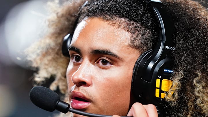 Oct 20, 2023; Carrollton, GA, USA; Carrollton Trojans quarterback Julian Lewis (10) watches on from the sidelines against the Westlake Lions during the first half at Grisham Stadium. The 15-year-old Carrollton High student has already committed to playing for the University of Southern California Trojans and has been considered one of the top high school quarterback prospects. 