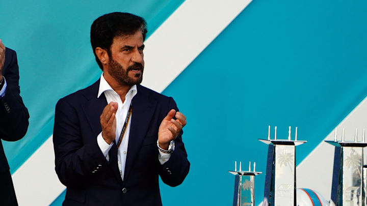 May 8, 2022; Miami Gardens, Florida, USA; Dan Marino and FIA president Mohammed Ben Sulayem applaud during the award ceremony following the Miami Grand Prix at Miami International Autodrome. Mandatory Credit: John David Mercer-Imagn Images