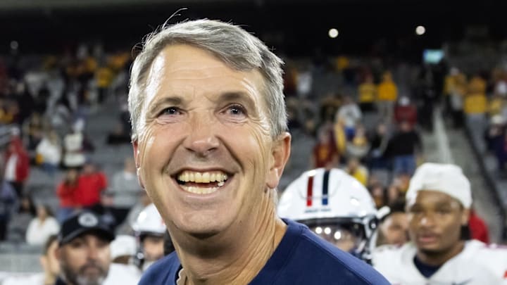 Nov 28, 2025; Tempe, Arizona, USA; Arizona Wildcats head coach Brent Brennan celebrates against the Arizona State Sun Devils during the 99th Territorial Cup at Mountain America Stadium. Mandatory Credit: Mark J. Rebilas-Imagn Images