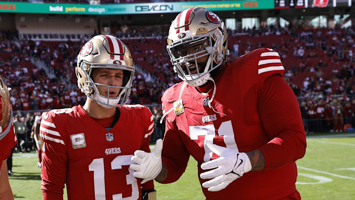 San Francisco 49ers quarterback Brock Purdy (L) and left tackle Trent Williams (R)