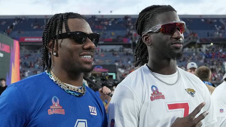 Feb 2, 2025; Orlando, FL, USA; NFC wide receiver Malik Nabers (1) poses with AFC wide receiver Brian Thomas Jr. of the Jacksonville Jaguars (7) during the 2025 Pro Bowl Games at Camping World Stadium. Mandatory Credit: Kirby Lee-Imagn Images