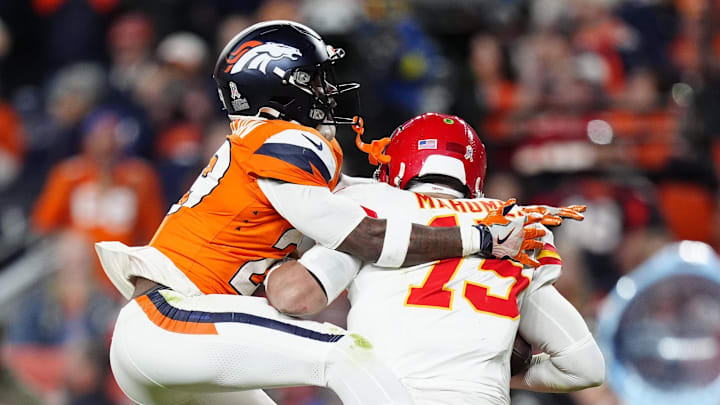 Nov 16, 2025; Denver, Colorado, USA; Denver Broncos cornerback Ja'Quan McMillian (29) sacks Kansas City Chiefs quarterback Patrick Mahomes (15) in the fourth quarter at Empower Field at Mile High. Mandatory Credit: Ron Chenoy-Imagn Images | Ron Chenoy-Imagn Images