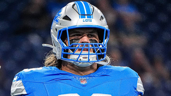 Detroit Lions guard Tate Ratledge (69) warms up ahead of the Chicago Bears game at Ford Field in Detroit on Sunday, Sept. 14, 2025.