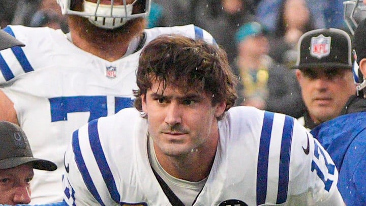 Indianapolis Colts quarterback Daniel Jones gets up off the turf