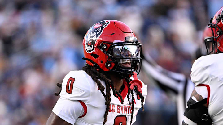 Nov 30, 2024; Chapel Hill, North Carolina, USA; North Carolina State Wolfpack linebacker Sean Brown (0) reacts after recovering a fumble in the first quarter at Kenan Memorial Stadium. Mandatory Credit: Bob Donnan-Imagn Images