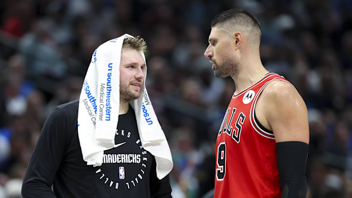 Nov 6, 2024; Dallas, Texas, USA; Dallas Mavericks guard Luka Doncic (77) laughs with Chicago Bulls center Nikola Vucevic (9) during the second half at American Airlines Center. Mandatory Credit: Kevin Jairaj-Imagn Images