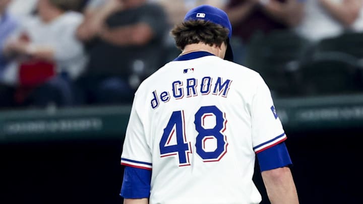 Apr 5, 2025; Arlington, Texas, USA; Texas Rangers starting pitcher Jacob deGrom (48) leaves during the sixth inning against the Tampa Bay Rays at Globe Life Field