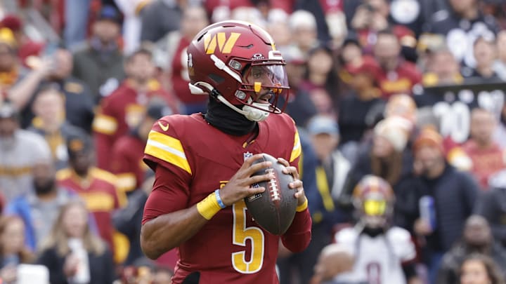 Nov 10, 2024; Landover, Maryland, USA; Washington Commanders quarterback Jayden Daniels (5) prepares to throw the ball against the Pittsburgh Steelers during the first half at Northwest Stadium. Mandatory Credit: Amber Searls-Imagn Images